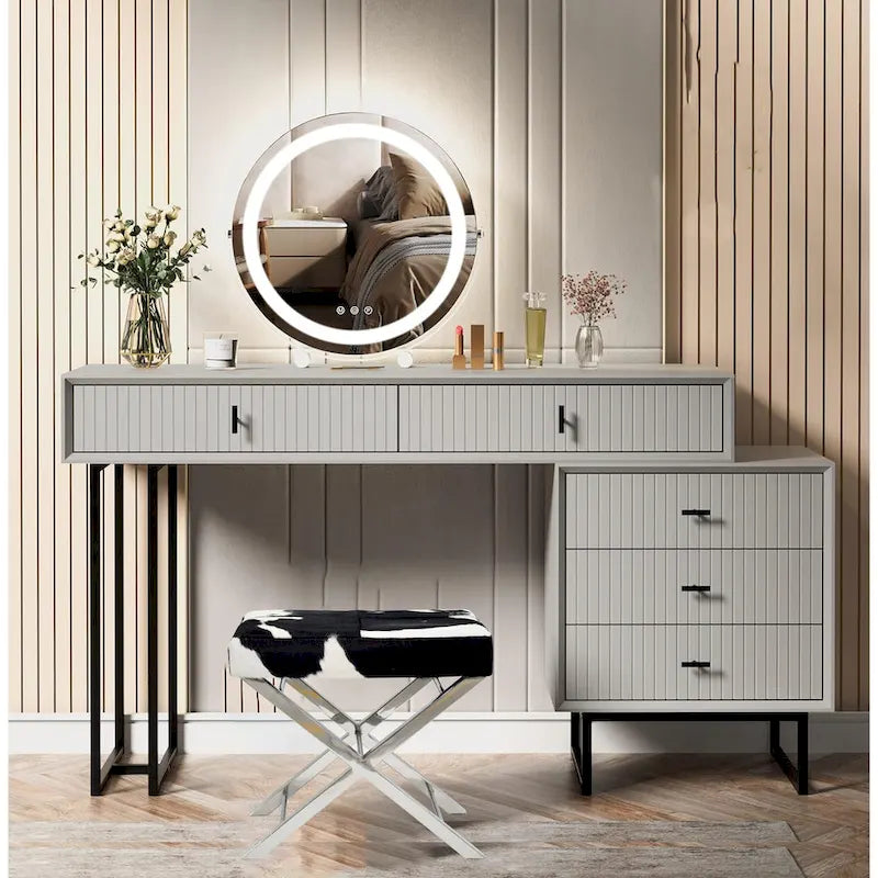 Poltrona pouf in acciaio inox cromato con pelle effetto pelo bianca e nera
